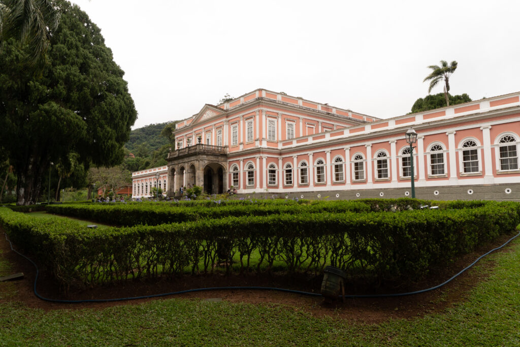 Front view of the Imperial Museum in Petrópolis, Rio de Janeiro, Brazil, showcasing its neoclassical architecture and lush gardens of the former imperial palace.